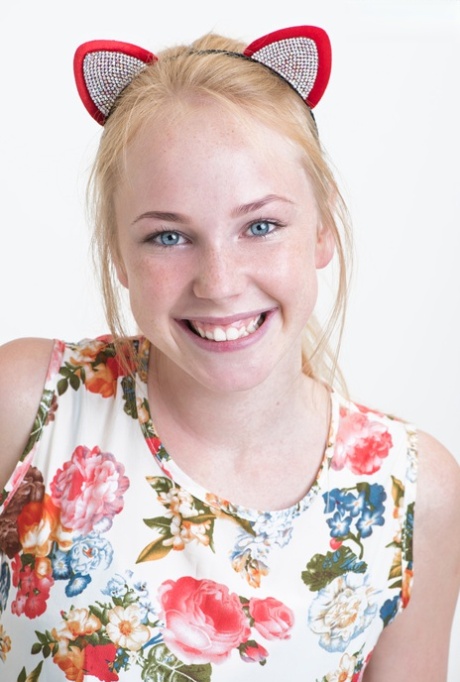 Adorable teenage girl with mouse ears and blonde hair, wearing heels and socks