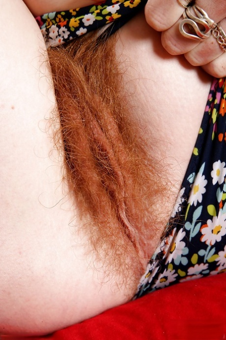 Ana Molly, a redhead mother, shows off her hairy vagina in close-ups.